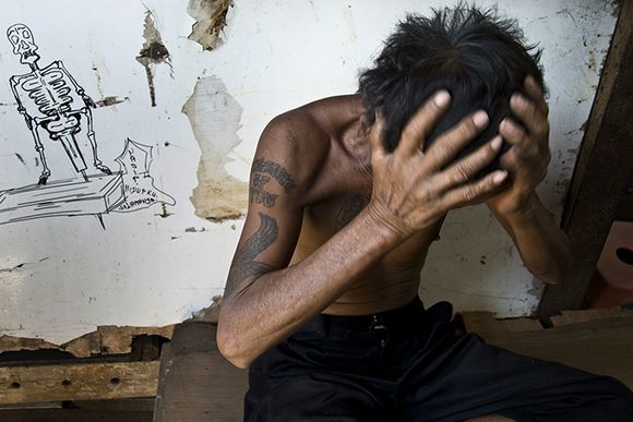 Down on his luck: a homeless man in a rough shelter ciliwung16.jpg