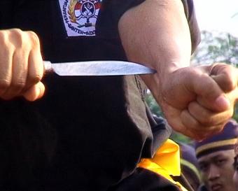 A performance of invulnerability involving members of the Banten martial arts and culture association. Such groups exercise a monopoly over the economic and political life of the province / Ian Wilson